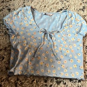 Light Blue crop top with sun flowers on it size L from SO